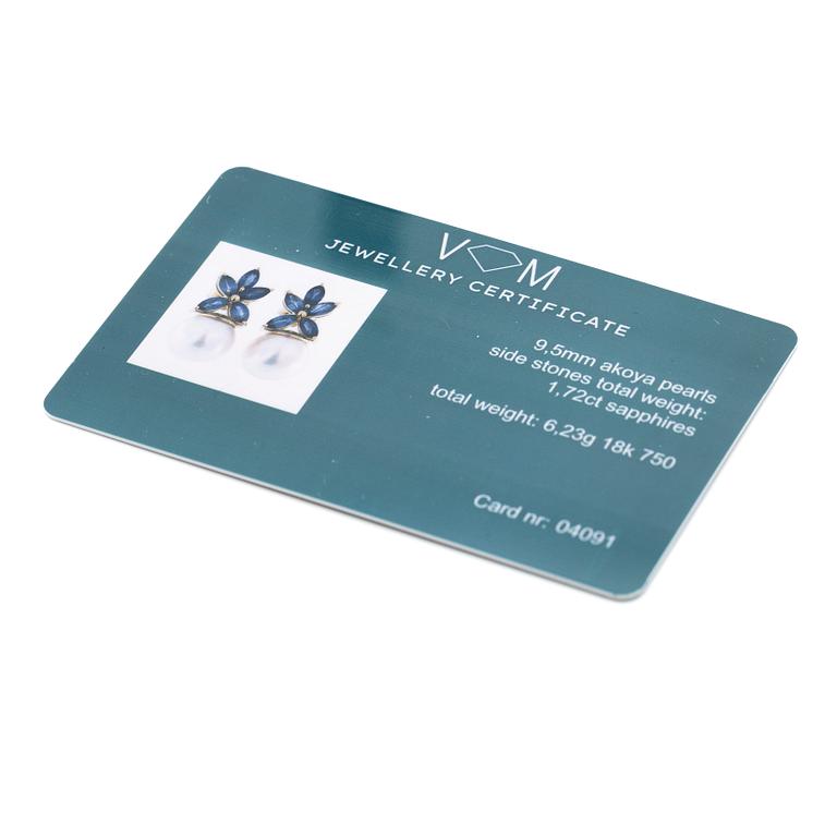 18K gold earrings with cultured Akoya pearls and navette-cut sapphires.