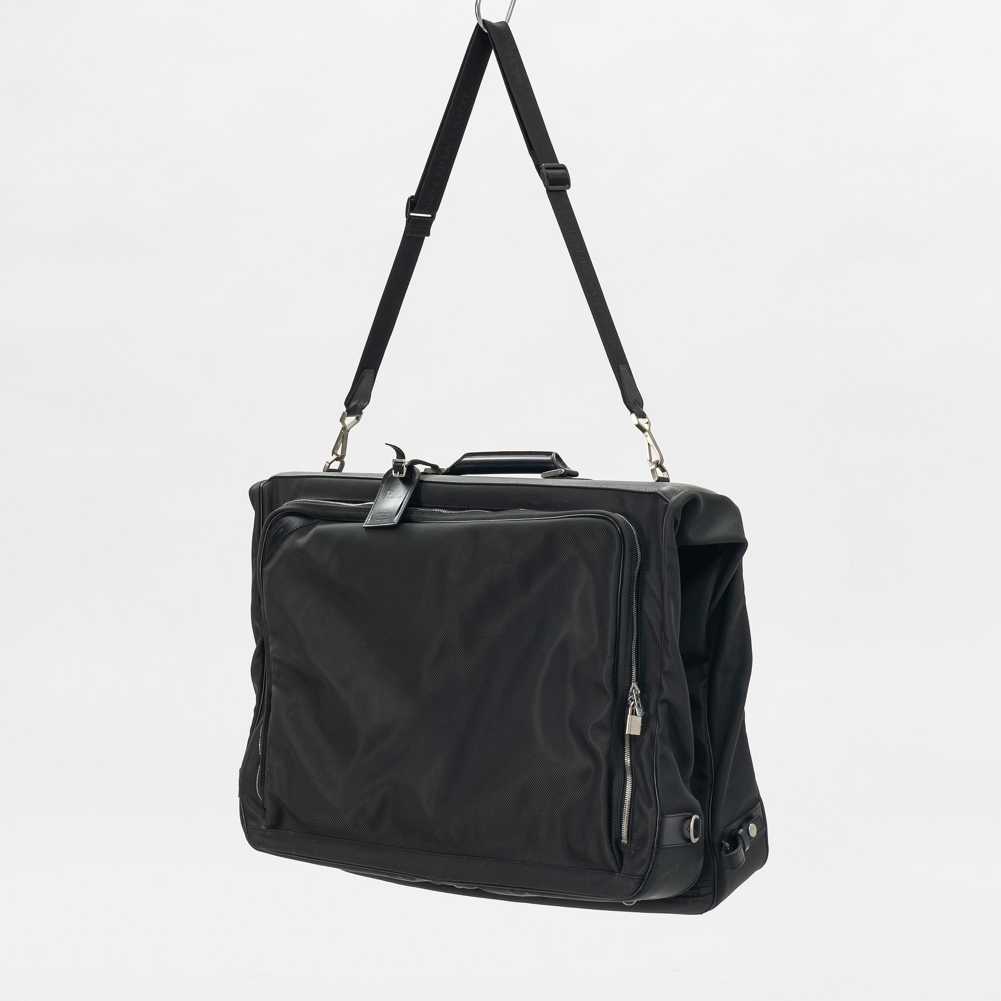 Louis Vuitton, a green canvas and Taiga garment bag.