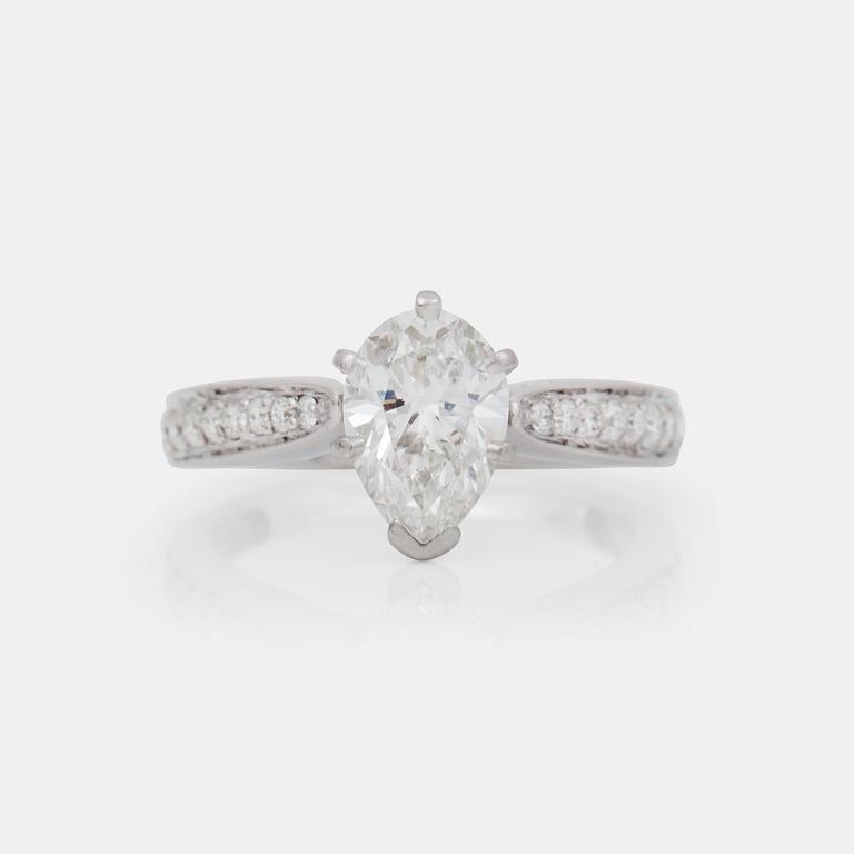 A pear-cut diamond, 1.57 cts, ring. GIA certificate. Pavé-set smaller diamonds on shank.