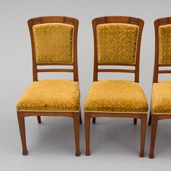 An early 20th century table with 4 chairs.