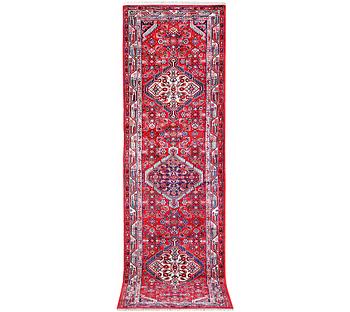 A Hamadan carpet, c. 304 x 84 cm.