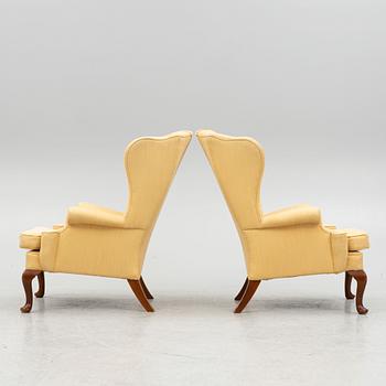 A pair of wingback armchairs, second half of the 20th century.