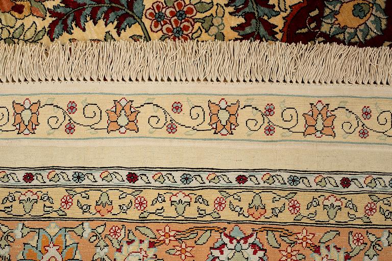 A rug, semi-antique, silke Hereke, signed, ca 184,5 x 118 cm.