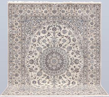 A Nain part silk carpet, 269 x 213 cm.