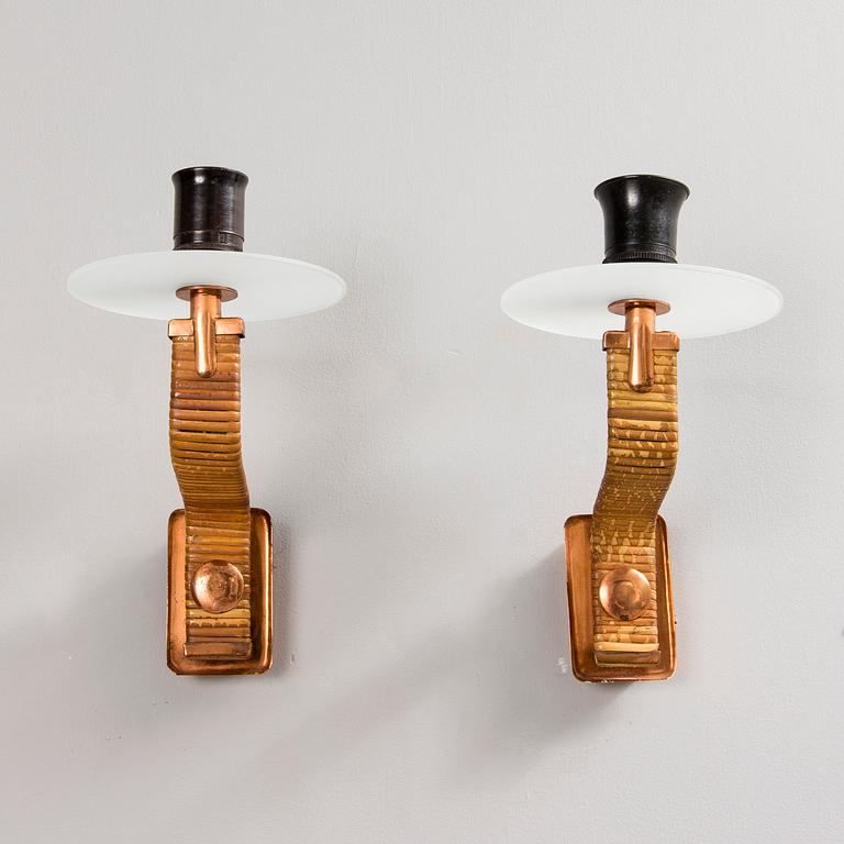 PAAVO TYNELL, A PAIR OF WALL LAMPS. Marked Taito. 1940-1950s.