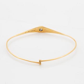 ARMRING, guld med gammalslipad diamant.