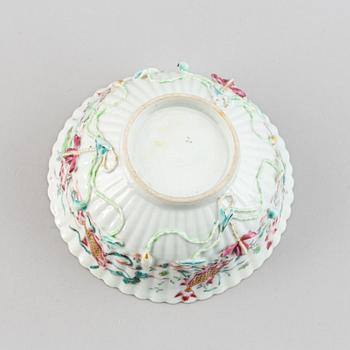 A famille rose relief moulded bowl, Qing dynasty, 18th century.