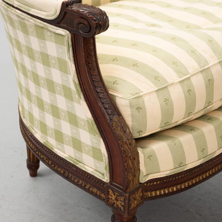 A pair of bergère armchairs, Louis XV style.