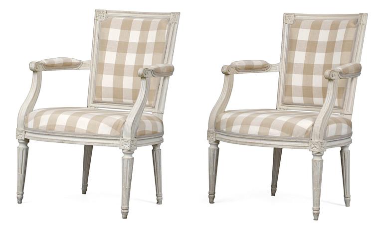 A pair of Louis XVI armchairs.
