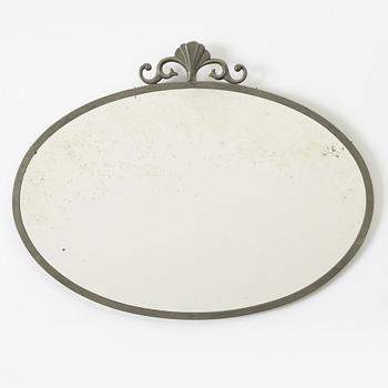 A Swedish Grace pewter mirror, 1920s/30s.