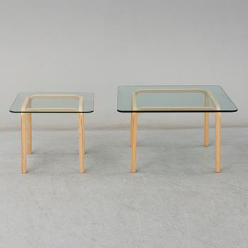 ALVAR AALTO, a pair of birch glass-top side tables from Arkek, Finland.