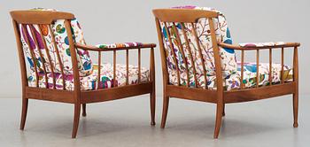 A pair of Kerstin Hörlin Holmquist mahogany arm chairs 'Skrindan', by OPE-möbler.