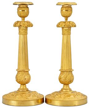 1049. A pair of Empire candlesticks.