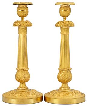 1049. A pair of Empire candlesticks.