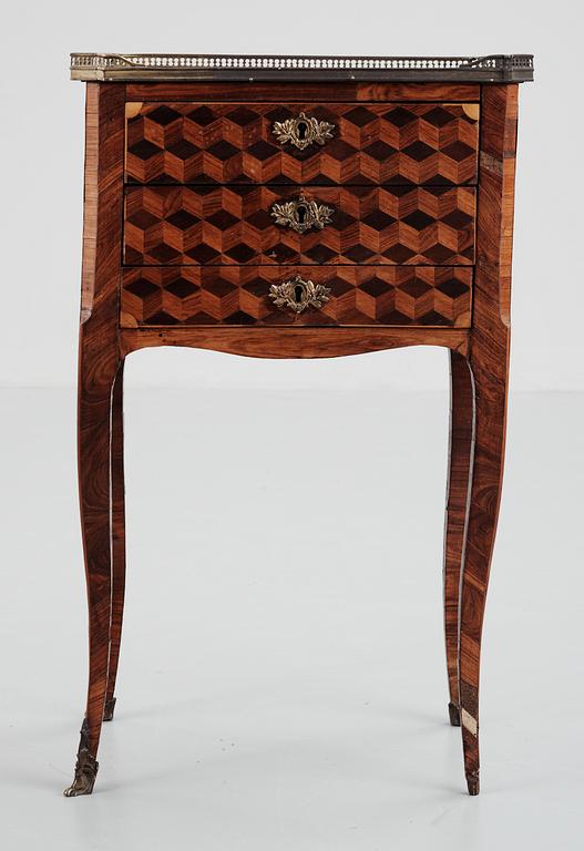 A Rococo-style 19th century commode.