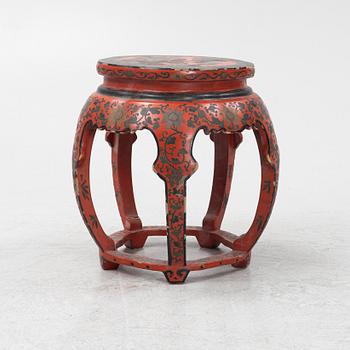 A Chinese red lacquer stool/table, 20th Century.