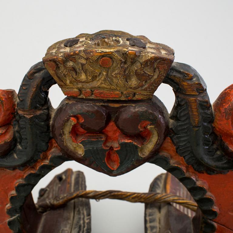 A carved and painted folk art horse hame 18/19th century.