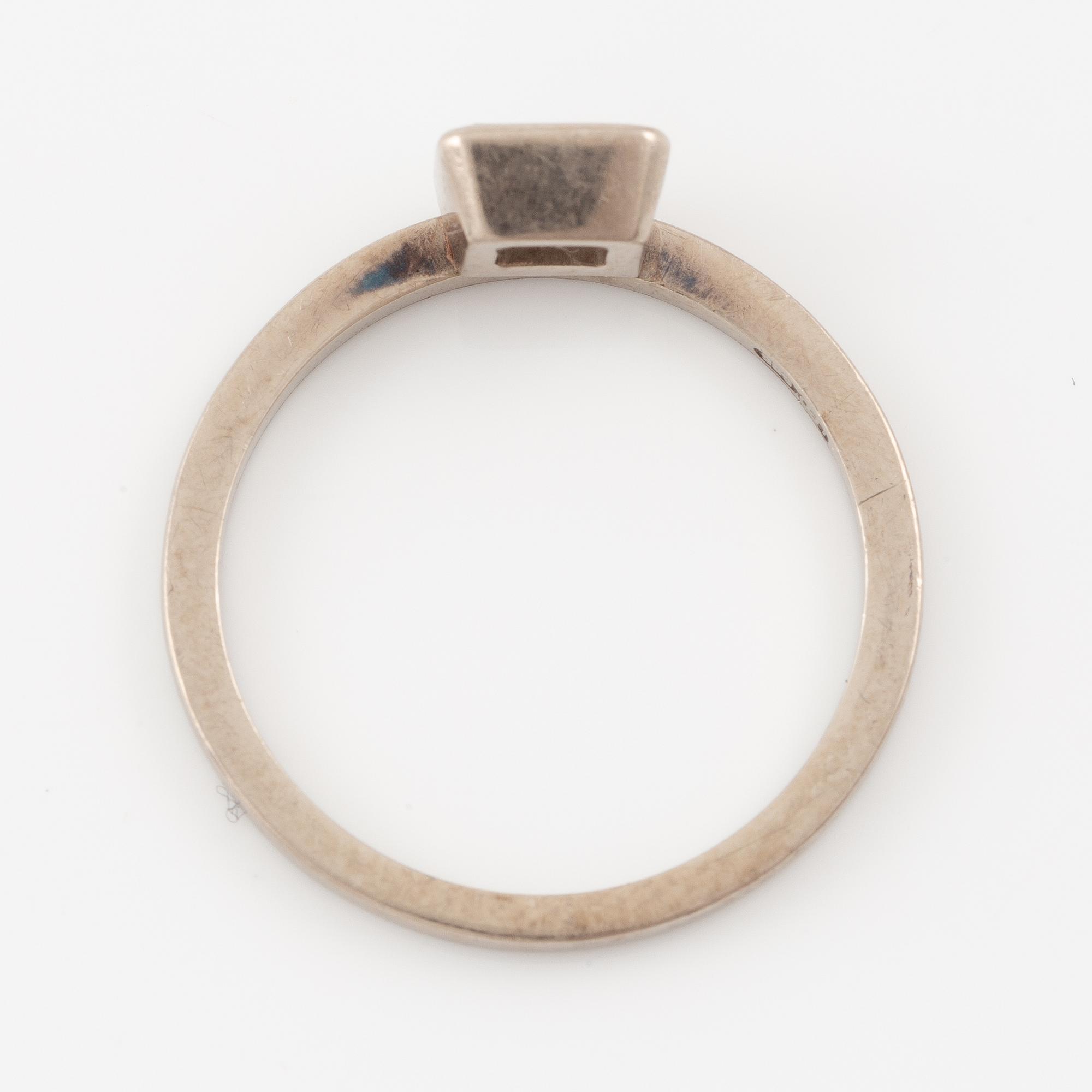 Ring, 14K white gold with emerald-cut diamond.