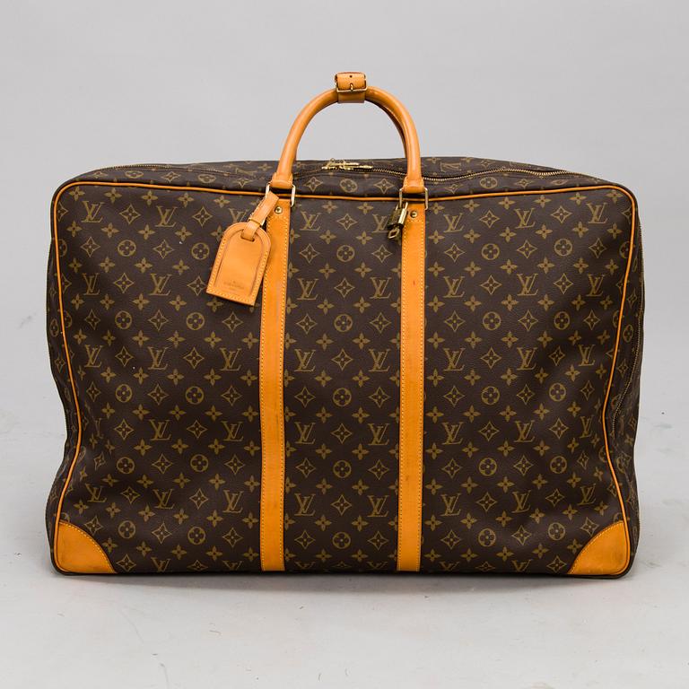 LOUIS VUITTON Monogram Canvas Sirius 65 Suitcase.