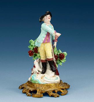 1260. A gilt bronze mounted 18th Century porcelain figure of a huntsman, presumably English.