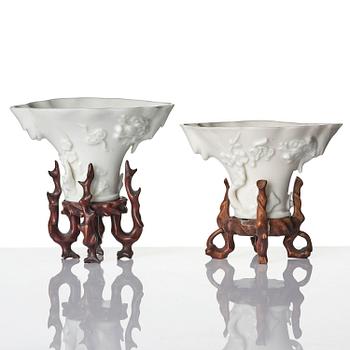 A pair of blanc de chine rhinoceros libation cups, Qing dynasty, Kangxi (1662-1722).