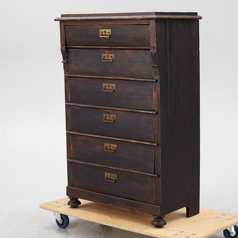 A chest of drawers, circa 1900.