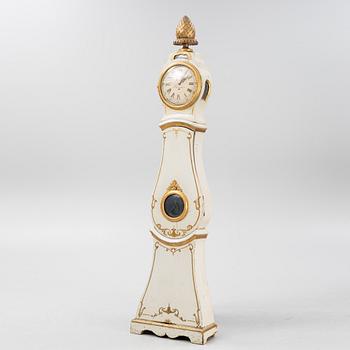 A long-case clock, 19th century.