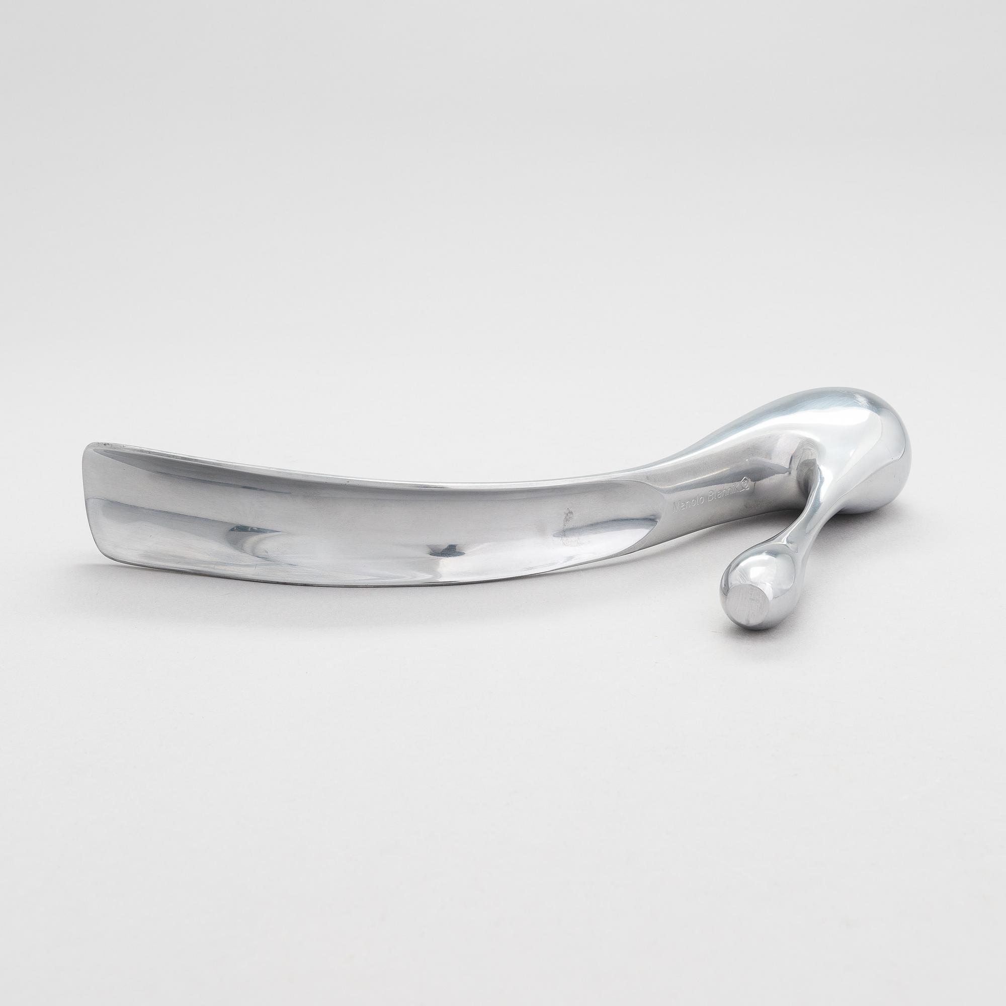 A metal shoe horn by Manolo Blahnik, 2000s.