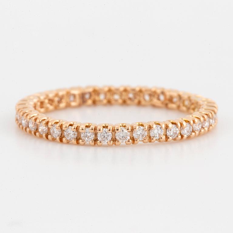 Brilliant-cut diamond eternity ring.