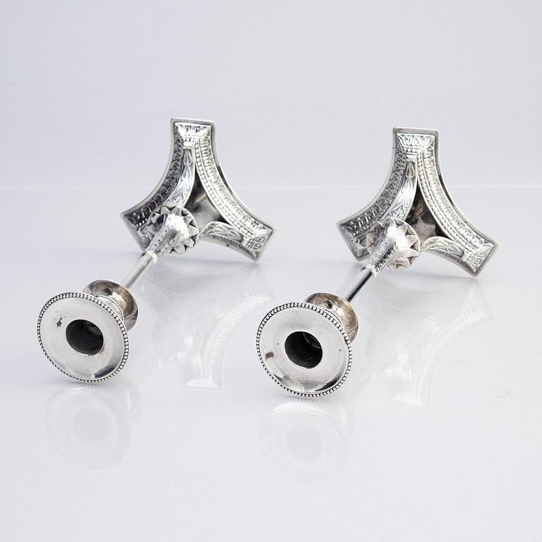 A pair of Swedish early 19th century silver candlesticks, marks of Adolf Zethelius, Stockholm 1817.