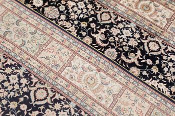 An oriental silk carpet, c. 283 x 184 cm.