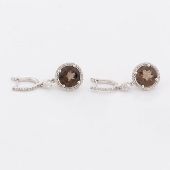 Smoky quartz and brilliant cut diamond earrings.