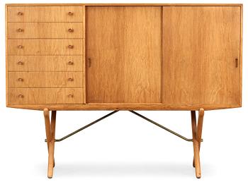 A Hans J Wegner oak cross-shaped leg sideboard by Andreas Tuck, Denmark.