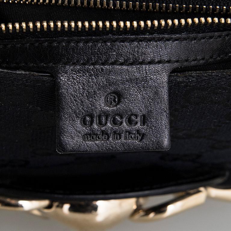 Gucci, a handbag.