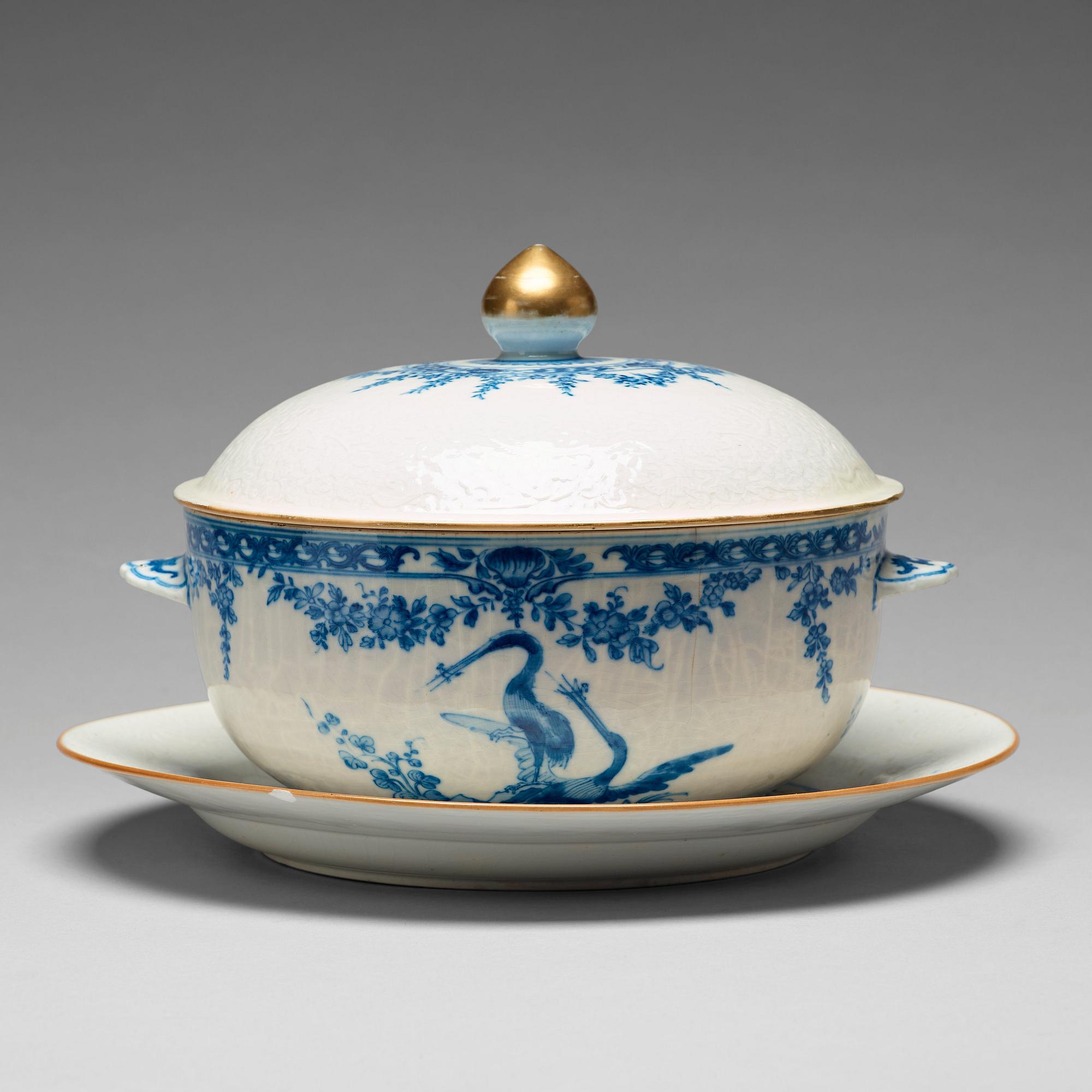 A blue and white armorial tureen with cover, and stand, Qing dynasty, 18th Century.