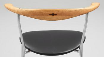Hans J. Wegner, a set of six "JH-701" oak and black leather chairs by Johannes Hansen, Denmark.