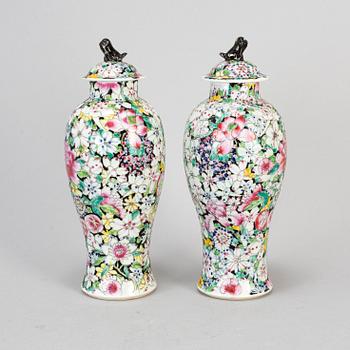A pair of Chinese 'Mille fleur' porcelain vases with covers, 20th century.