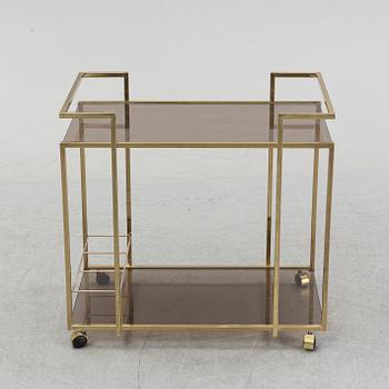 A brass and glass drink trolley, end of the 20th Century.