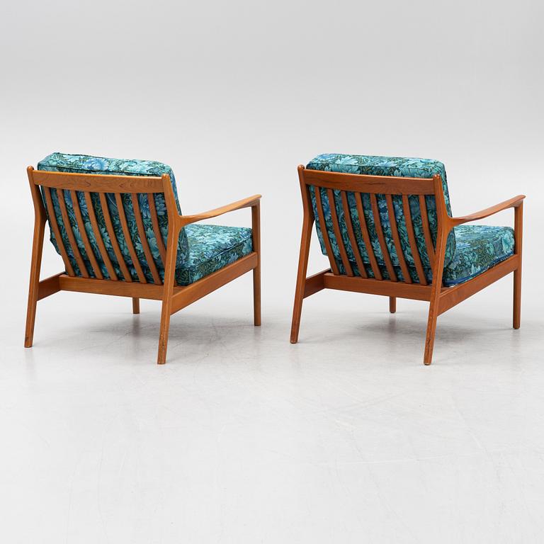 Folke Ohlsson, a pair of 'USA 75' armchairs, Dux, Sweden, 1960's.