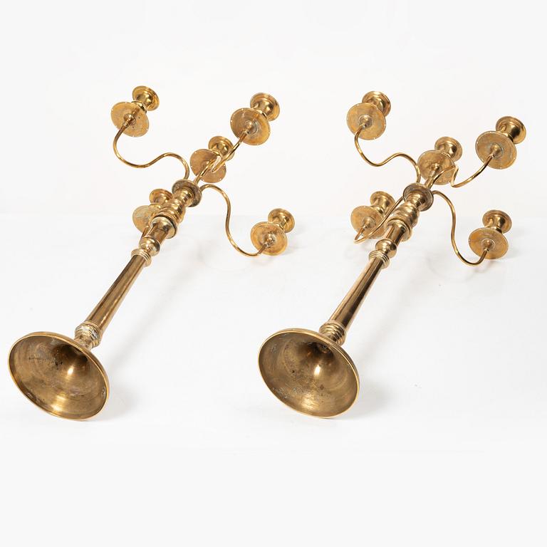 A pair of brass candelabra, model N12, Nyköpings Bruk, Sweden, around 1900.