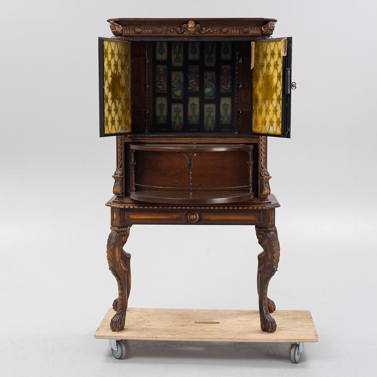 A Baroque style drinks cabinet, first half of the 20th Century.