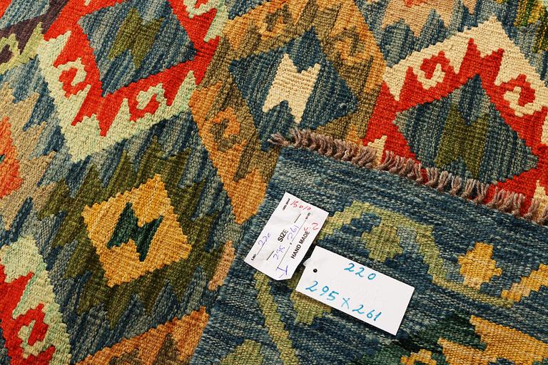 A Kilim carpet, c. 295 x 261 cm.