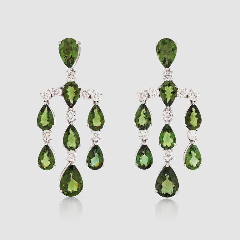 A pair of green tourmaline and brilliant-cut diamond earrings.