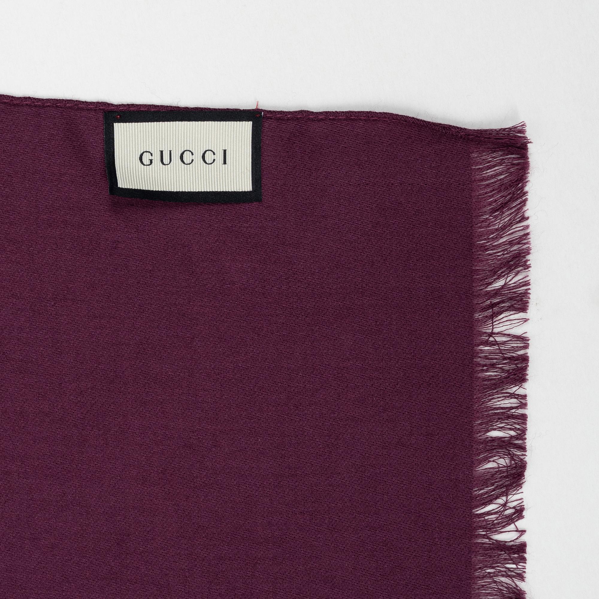 Gucci, a wool and silk mix "GG" jaquard shawl.