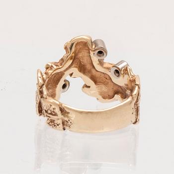A 14K white and red gold ring with round brilliant cut diamonds.