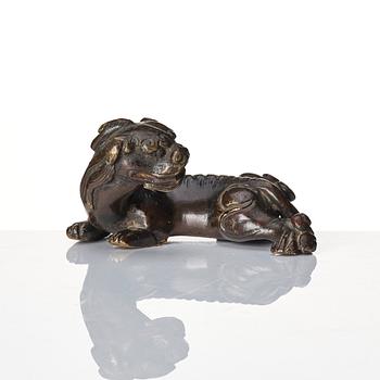 A group of four bronze figures, Ming dynasty and older.