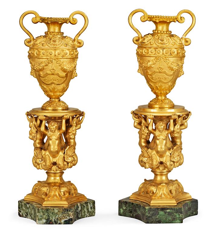 A pair of Italian 19th century gilt bronze and marble urns.
