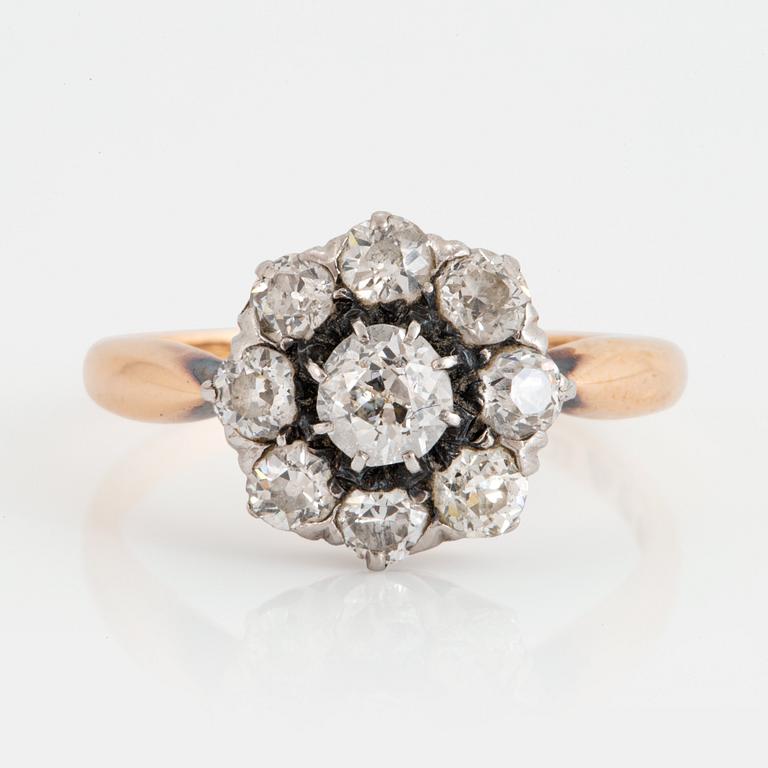 An 18K gold ring set with old-cut diamonds.