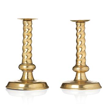 250. A pair of Northern European cast brass baroque candlesticks, circa 1700.