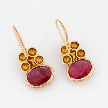 18K gold and cabochon-cut ruby earrings.